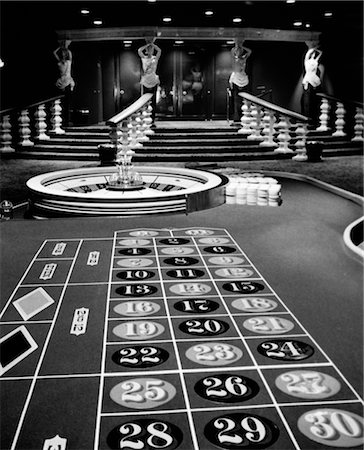 simsearch:846-02793393,k - 1960s CASINO VIEWED FROM END OF ROULETTE TABLE OPPOSITE OF WHEEL LOOKING TOWARD STATUES Stock Photo - Rights-Managed, Code: 846-02793424