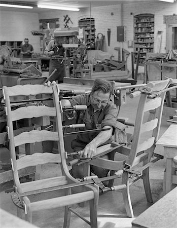 1970s MAN IN GLASSES & WORK CLOTHES ASSEMBLING LADDER-BACK CHAIRS IN SMALL WORKSHOP Stock Photo - Rights-Managed, Code: 846-02793425