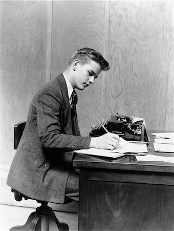 student vintage - 1940s YOUNG MAN SITTING AT DESK WRITING MANUAL TYPEWRITER STUDY COLLEGE OFFICE BUSINESSMAN OR STUDENT Stock Photo - Rights-Managed, Code: 846-02793574