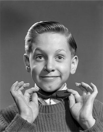 1950s BOY ADJUSTING BOW TIE BOW-TIE Stock Photo - Rights-Managed, Code: 846-02793715