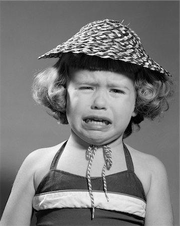 1960s PORTRAIT OF GIRL WEARING STRAW HAT AND CRYING Stock Photo - Rights-Managed, Code: 846-02793786