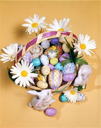 simsearch:846-03164194,k - 1970s EASTER STILL LIFE OVERHEAD VIEW BASKET FILLED WITH CANDY DECORATED EGGS DAISIES BUNNY FIGURINES Stock Photo - Rights-Managed, Code: 846-03164204