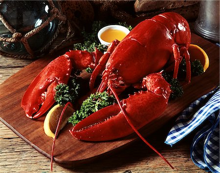 COOKED LOBSTER ON WOODEN PLATTER WITH LEMON WEDGE AND DRAWN BUTTER Stock Photo - Rights-Managed, Code: 846-03164207