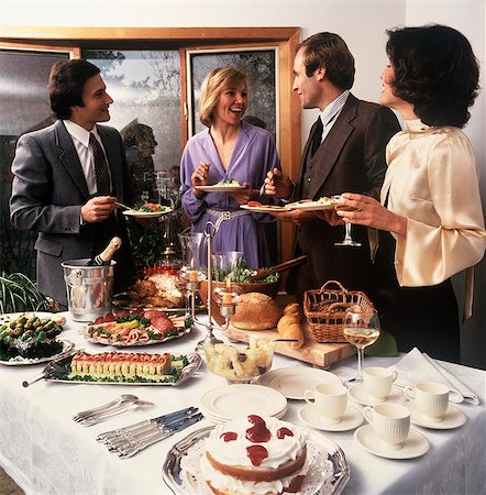 people party retro not outdoors not indoors not illustration - 1970s TWO COUPLES SOCIALIZING AT PARTY BUFFET TABLE Stock Photo - Rights-Managed, Code: 846-03164261