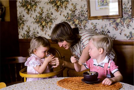 1980s MOTHER & TWO CHILDREN AT BREAKFAST TABLE Stock Photo - Rights-Managed, Code: 846-03164272