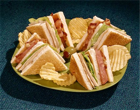 sandwich and chips - 1960s TOASTED CLUB SANDWICH TURKEY BACON LETTUCE TOMATO GREEN PLATE Stock Photo - Rights-Managed, Code: 846-03164484