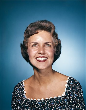 1960s SMILING WOMAN IN PRINT DRESS LOOKING UP STUDIO Stock Photo - Rights-Managed, Code: 846-03164515