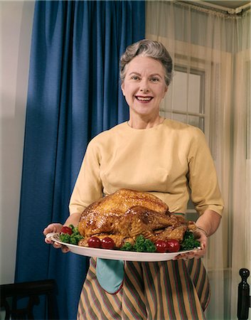 female thanksgiving - 1960s WOMAN TURKEY DINNER THANKSGIVING Stock Photo - Rights-Managed, Code: 846-03164604