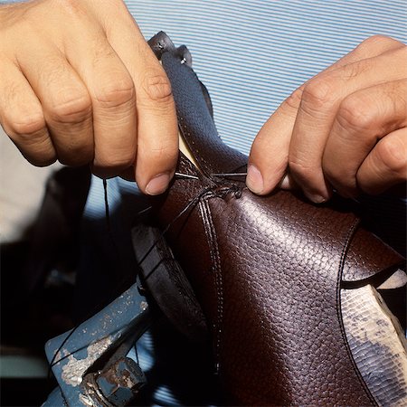 shoe hand - 1970s DETAIL HANDS SEWING LEATHER SHOES PUERTO RICO MANUFACTURING HAND SEWN Stock Photo - Rights-Managed, Code: 846-03164708