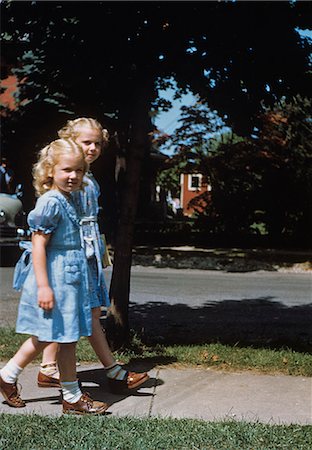 first - 1950s TWO BLOND GIRLS WEARING BLUE DRESSES ON THE FIRST DAY OF SCHOOL Stock Photo - Rights-Managed, Code: 846-03164805