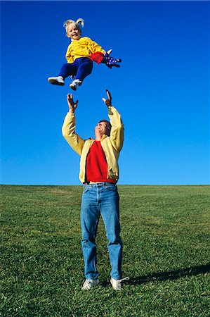 preteen child modeling - FATHER THROWING DAUGHTER UP IN THE AIR Stock Photo - Rights-Managed, Code: 846-03164831