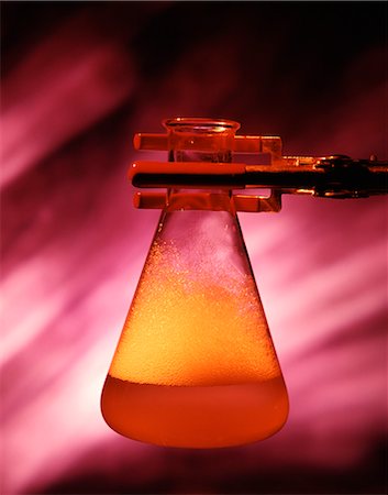 1970s LABORATORY STILL LIFE OF METAL SUPPORT HOLDING FLASK FILLED WITH RED SUDSY LIQUID Stock Photo - Rights-Managed, Code: 846-03164923