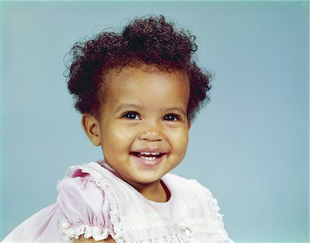 1960s PORTRAIT AFRICAN-AMERICAN GIRL TODDLER SMILING HAPPY WEARING PINK LACY DRESS Stock Photo - Rights-Managed, Code: 846-03165085