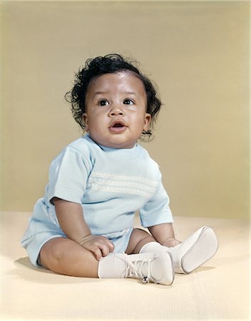 peeping baby - 1960s PORTRAIT AFRICAN-AMERICAN BABY BOY WEARING BLUE OUTFIT WHITE SHOES LOOKING TO SIDE Stock Photo - Rights-Managed, Code: 846-03165097