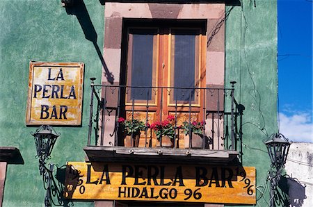 SAN MIGUEL D ALLENDE, MEXICO PAINTED BALCONY OVER BAR Stock Photo - Rights-Managed, Code: 846-03165434