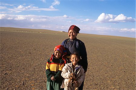 simsearch:841-05796518,k - GOBI DESERT, MONGOLIA SMILING MOTHER AND TWO DAUGHTERS Stock Photo - Rights-Managed, Code: 846-03165438