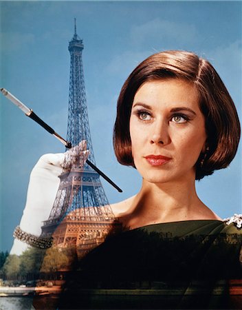 simsearch:846-02797696,k - 1960s 1970s COMPOSITE ELEGANT WOMAN HOLD CIGARETTE HOLDER AGAINST PARIS SCENE EIFFEL TOWER Stock Photo - Rights-Managed, Code: 846-03165560