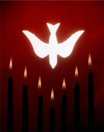 SYMBOLIC WHITE DOVE DESCENDING IN TO CANDLES REPRESENTING PENTECOST FLAMES Stock Photo - Rights-Managed, Code: 846-03165610