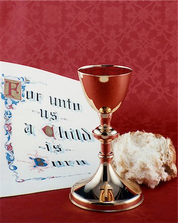COMMUNION CHALICE WITH BREAD AND CHRISTMAS SCRIPTURE FOR UNTO US A CHILD IS BORN Stock Photo - Rights-Managed, Code: 846-03165613
