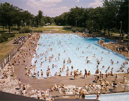 1950s 1960s PUBLIC SWIMMING POOL KIDS CHILDREN SUMMER GREEN BAY WISCONSIN VIEW FROM ABOVE Stock Photo - Rights-Managed, Code: 846-03165804