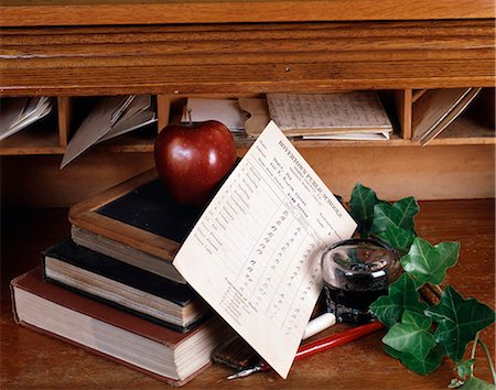 OLD TIME SCHOOL STILL LIFE WITH INKWELL PEN REPORT CARD SLATE BOOKS IVY ON WOODEN DESK Stock Photo - Rights-Managed, Code: 846-03165849