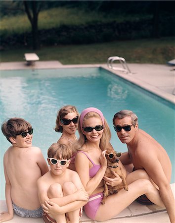 retro child dog - 1960s 1970s FAMILY ALL WEARING SUNGLASSES BESIDE SWIMMING POOL Stock Photo - Rights-Managed, Code: 846-03165884