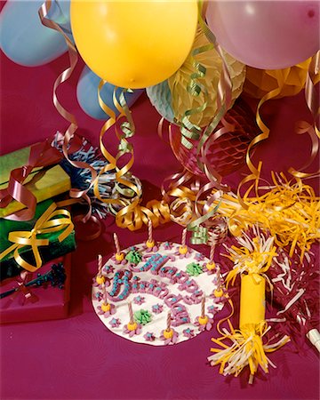 people party retro not outdoors not indoors not illustration - 1960s STILL LIFE OF HAPPY BIRTHDAY DECORATIONS PINK YELLOW BALLOONS STREAMERS GIFTS Stock Photo - Rights-Managed, Code: 846-03166028