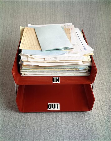 filled - 1960s RED OFFICE LETTER TRAY IN AND OUT BIN IN FILLED WITH PAPERWORK Stock Photo - Rights-Managed, Code: 846-03166039