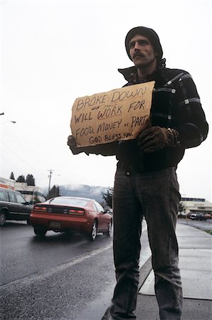 pobre - MAN ON ROADSIDE HOLDING SIGN REQUESTING WORK Foto de stock - Con derechos protegidos, Código: 846-03166156