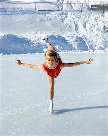 1970s SMILING BLOND WOMAN FIGURE SKATER SKATING IN RED COSTUME Stock Photo - Rights-Managed, Code: 846-03166184