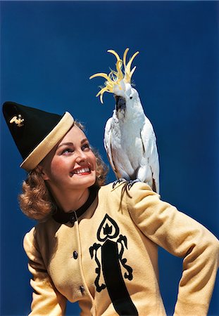 1940s SMILING BLOND WOMAN LOOKING AT COCKATOO ON HER SHOULDER Stock Photo - Rights-Managed, Code: 846-03166361