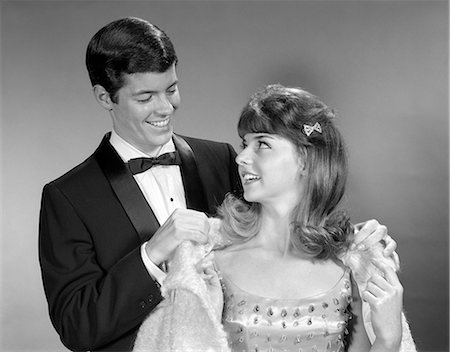 picture of adult boys in formal dress - 1960s MALE FEMALE DRESS FORMAL PUTTING ON COAT Stock Photo - Rights-Managed, Code: 846-03163405