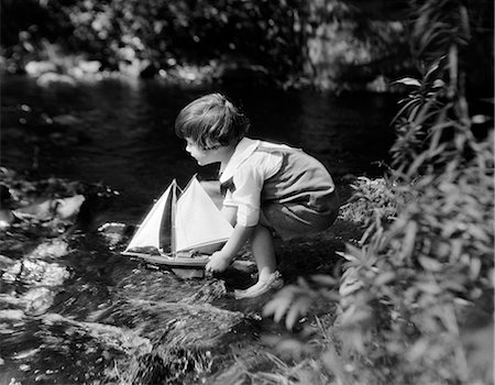 1920s CHILD SAILING SAILBOAT STREAM Stock Photo - Rights-Managed, Code: 846-03163420