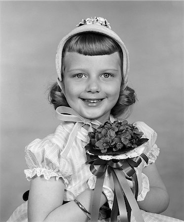 photography figure girls - 1950s CHILD HOLDING FLOWERS SMILING Stock Photo - Rights-Managed, Code: 846-03163431