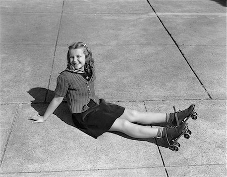 roller skate retro - 1940s CHILD SITTING ON GROUND WEARING ROLLER-SKATES Stock Photo - Rights-Managed, Code: 846-03163559