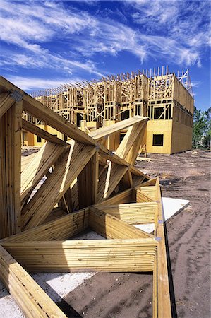 WOODEN FRAMES ON CONSTRUCTION SITE OF TOWNHOUSES Fotografie stock - Rights-Managed, Codice: 846-03163770