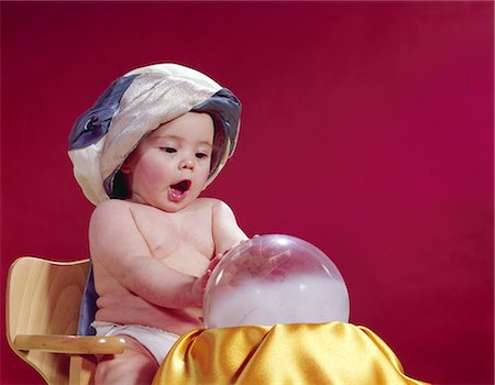 1960s BABY FORTUNE TELLER WEARING TURBAN SEATED WITH CRYSTAL BALL Fotografie stock - Rights-Managed, Codice: 846-03163882