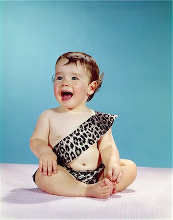 1960s LAUGHING HAPPY BABY MOUTH WIDE OPEN WEARING LEOPARD PRINT TARZAN CAVEMAN COSTUME Stock Photo - Rights-Managed, Code: 846-03163929