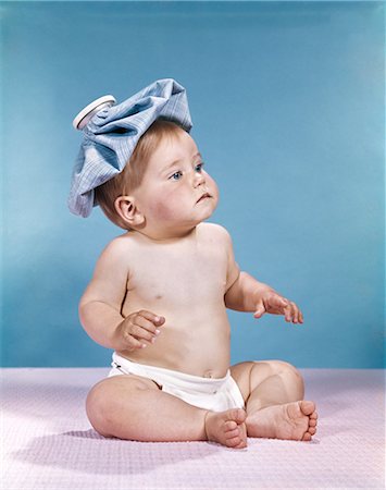 pack ice - 1960s BABY SITTING WITH ICE PACK ON TOP OF HEAD Stock Photo - Rights-Managed, Code: 846-03163953