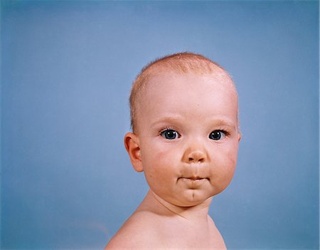 simsearch:846-03163865,k - 1970s PORTRAIT BABY BLUE BACKGROUND PURSED LIPS FACIAL EXPRESSION Stock Photo - Rights-Managed, Code: 846-03163985