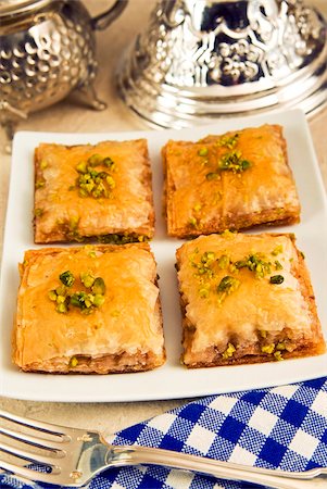 Baklava, sweet pastry made of layers of filo pastry filled with chopped nuts and sweetened with syrup or honey, Arabic gastronomy, Middle East Stock Photo - Rights-Managed, Code: 841-05784028