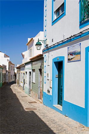 portugal village - Narrow street in Ferragudo fishing village, Portimao City, Algarve, Portugal, Europe Stock Photo - Rights-Managed, Code: 841-05784353