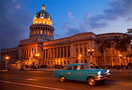 Traditional old American car speeding past the Capitolio building at night, Havana, Cuba, West Indies, Central America Stock Photo - Rights-Managed, Code: 841-05784607