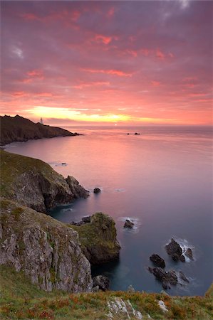 south hams - Glorious sunrise off the coast of Start Point, with the lighthouse on the distant headland, South Hams, Devon, England, United Kingdom, Europe Stock Photo - Rights-Managed, Code: 841-05785110