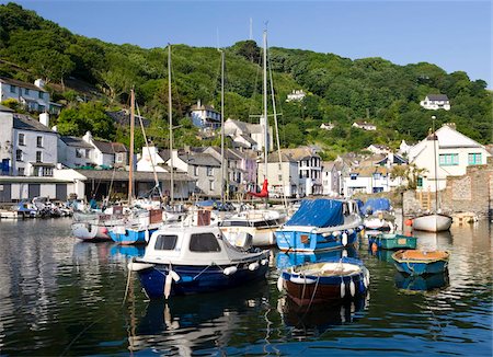 polperro - Boats and cottages surround the pretty harbour in the fishing village of Polperro, Cornwall, England, United Kingdom, Europe Stock Photo - Rights-Managed, Code: 841-05785181