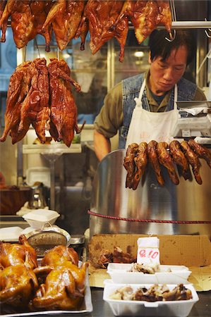 Man selling roast chicken and duck at market, Causeway Bay, Hong Kong, China, Asia Stock Photo - Rights-Managed, Code: 841-05785282