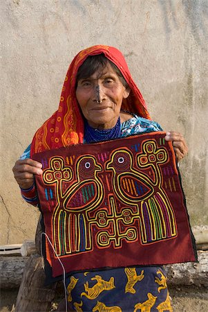 panama people - Kuna woman holding a handmade mola, Playon Chico Village, San Blas Islands (Kuna Yala Islands), Panama, Central America Stock Photo - Rights-Managed, Code: 841-05785423