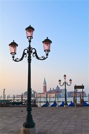 europe city waterfront - Gondolas moored by Riva degli Schiavoni, looking towards San Giorgio Maggiore, Venice, UNESCO World Heritage Site, Veneto, Italy, Europe Stock Photo - Rights-Managed, Code: 841-05785604