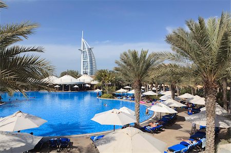 Burj Al Arab seen from the swimming pool of the Madinat Jumeirah Hotel, Jumeirah Beach, Dubai, United Arab Emirates, Middle East Stock Photo - Rights-Managed, Code: 841-05785645