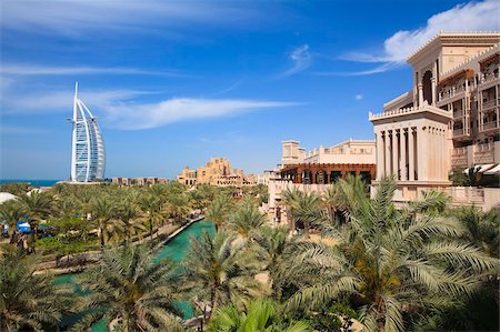 dubai luxury hotel - Burj Al Arab and Madinat Jumeirah in foreground, the iconic Burj Al Arab is the World's tallest hotel at 321 metres, Jumeirah, Dubai, United Arab Emirates, Middle East Stock Photo - Rights-Managed, Code: 841-05785647